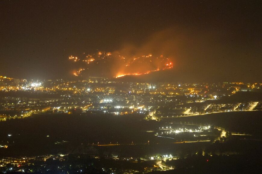 A wildfire sparked by Hezbollah rockets rages outside the northern Israeli town of Kiryat Shmona earlier this month