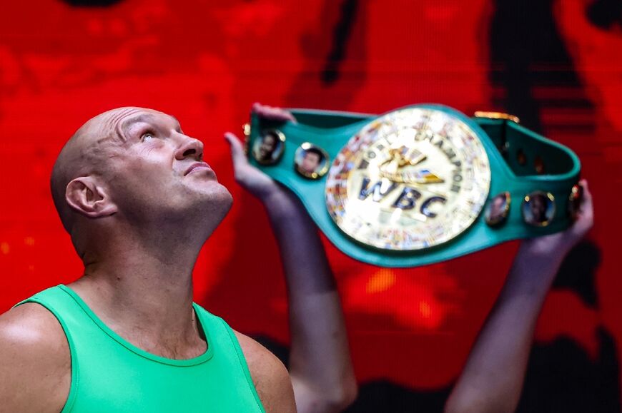 Britain's Fury holds the WBC belt