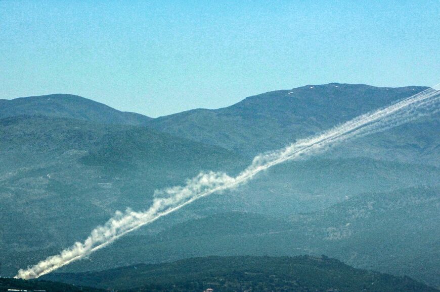 Rockets leave trails of smoke as they are launched from southern Lebanon