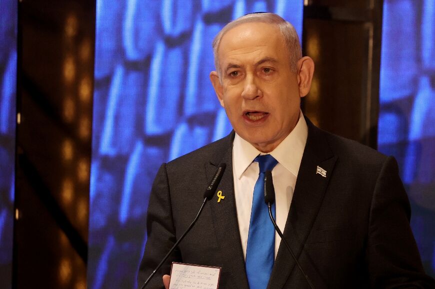 Israeli Prime Minister Benjamin Netanyahu addresses a ceremony marking Memorial Day for fallen soldiers of Israel's wars and victims of attacks, at Jerusalem's Mount Herzl military cemetery on May 13, 2024