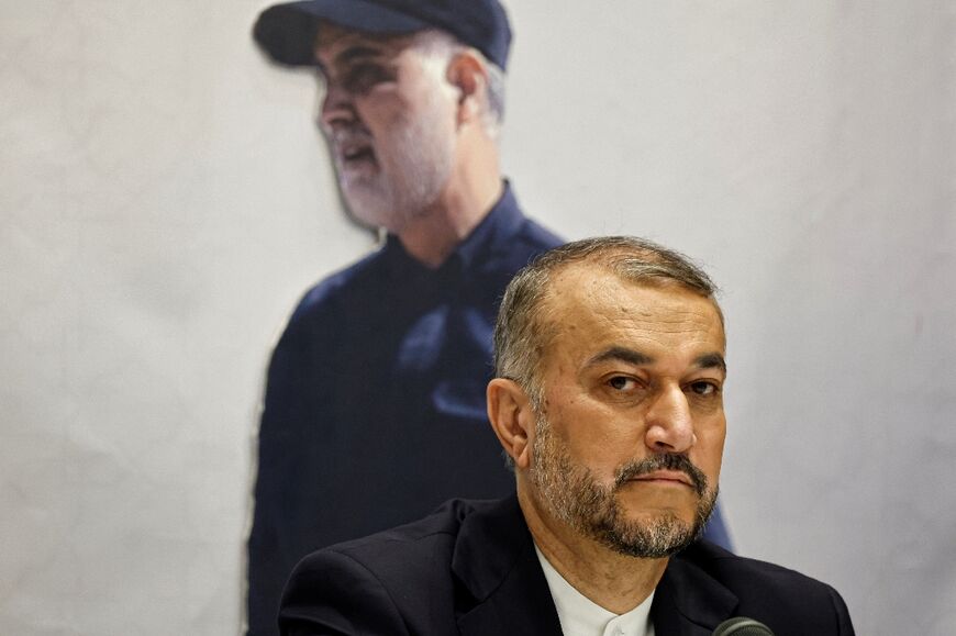 Amir-Abdollahian in the Iranian Embassy in Beirut in front of a picture of late Revolutionary Guards general Qasem Soleimani