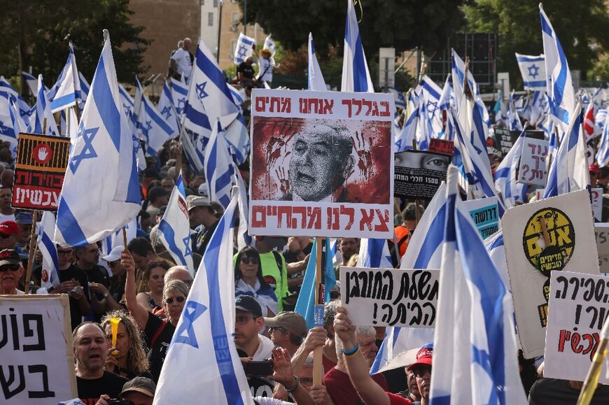 Israelis protest against Prime Minister Benjamin Netanyahu's government in front of the Israeli parliament in Jerusalem on May 20, 2024
