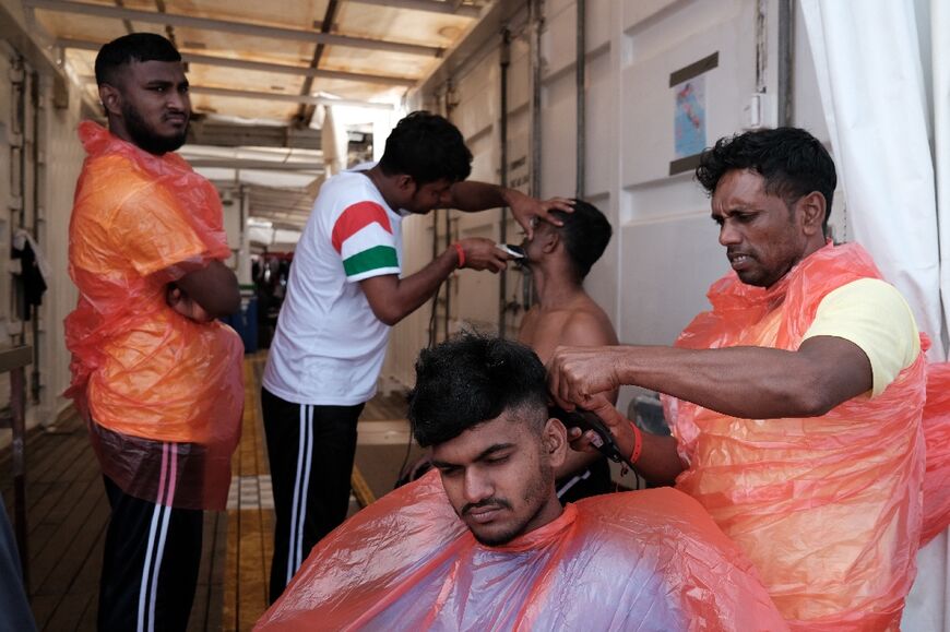 Haircuts are part of the Ocean Viking crew's efforts to instill a sense of normalcy after traumatic sea rescues