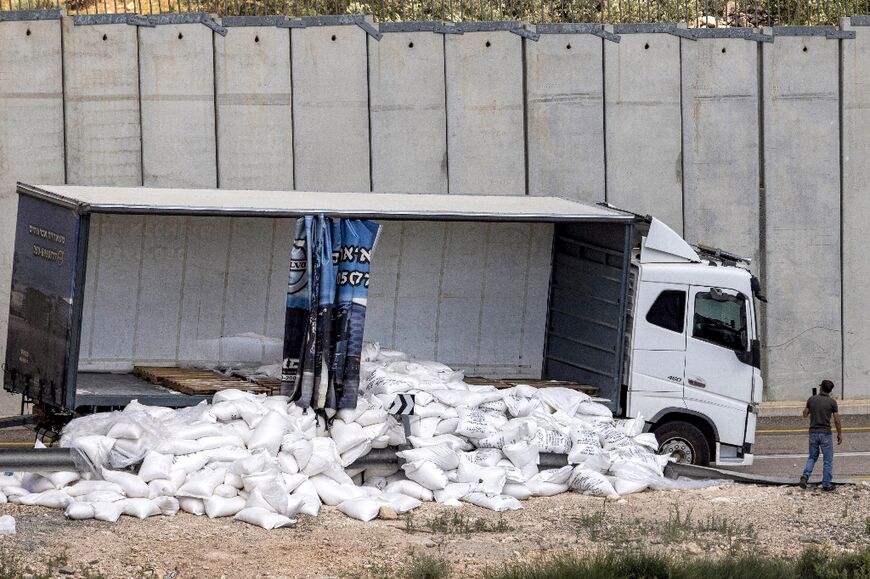A truck with scattered aid supplies for Gaza after it was vandalised by right-wing Israeli activists near the West Bank village of Shekef on May 13, 2024