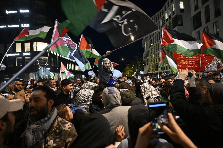 Police pushed back protesters outside the arena where more than a hundred demonstrators waved flags and chanted 'Free Palestine'