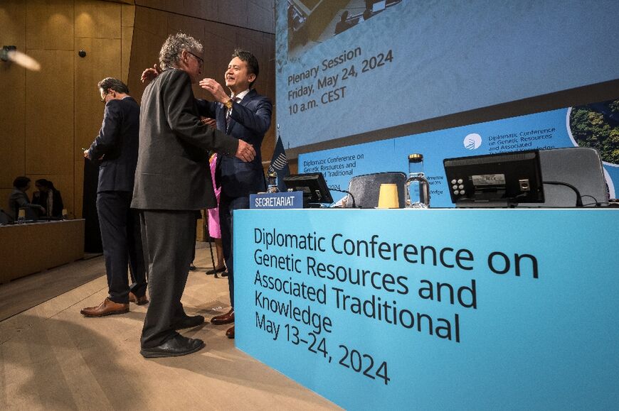 WIPO Director General Daren Tang (R) greeted delegates at the conference