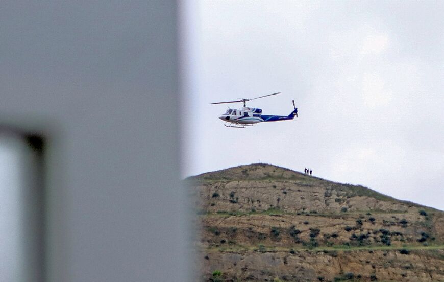 A photo provided by the Islamic Republic News Agency IRNA on May 19, 2024 shows the helicopter carrying Iran's President Ebrahim Raisi taking off at the Iranian border with Azerbaijan