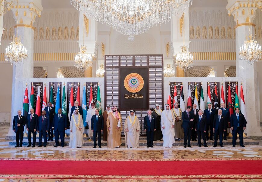 A Bahrain News Agency picture shows King Hamad bin Isa al-Khalifa (C) with Arab leaders at the Manama summit