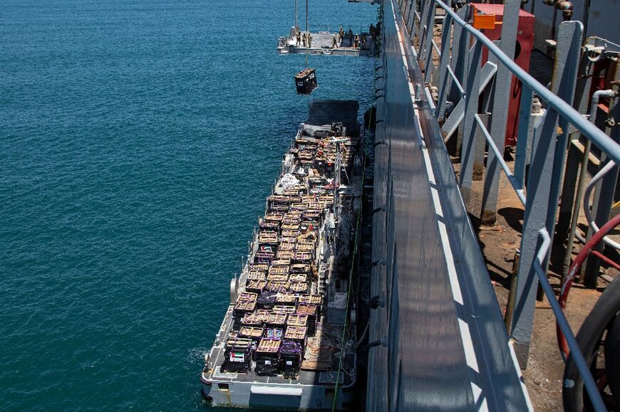 A picture released by CENTCOM shows aid being lifted onto a barge at the Israeli port of Ashdod