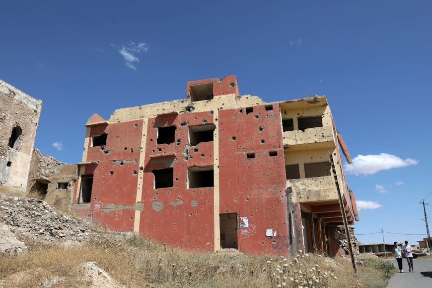 A building damaged during the 2014 attack by Islamic State (IS) fighters and the battles that followed, in the town of Sinjar in the northern Iraqi Nineveh province 