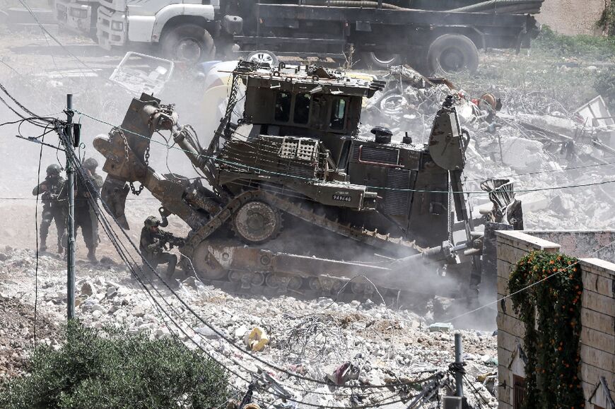 Israeli troops deployed a bulldozer to flatten the house where the suspects were holed up