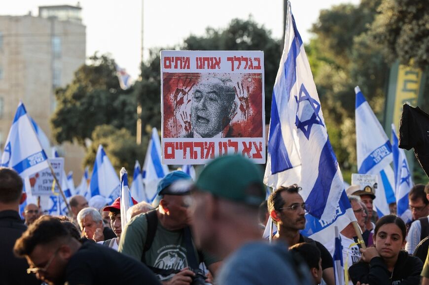 Israelis at an anti-government rally in Jerusalem calling for an end to the Gaza war and early elections