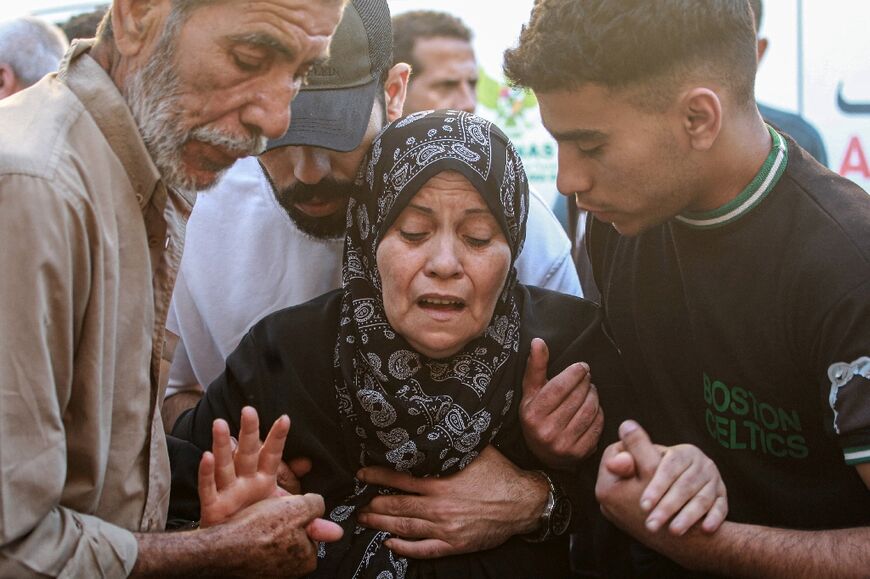 A Palestinian woman mourns her relative, killed in an Israeli strike in central Gaza's Deir al-Balah
