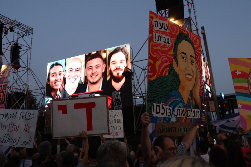 A billboard depicting the four Israeli hostages rescued by special forces, at a Tel Aviv rally calling for the return of the other captives