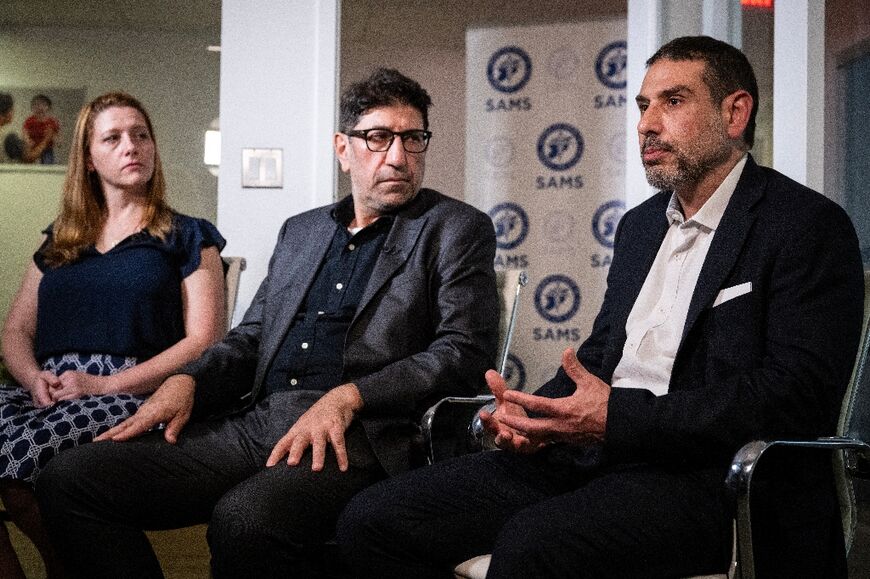 (L-R) Nurse Monica Johnston, Dr. Ammar Ghanem, and Dr. Adam Hamawy speak during an interview with AFP after meetings at the White House and Capitol Hill in Washington