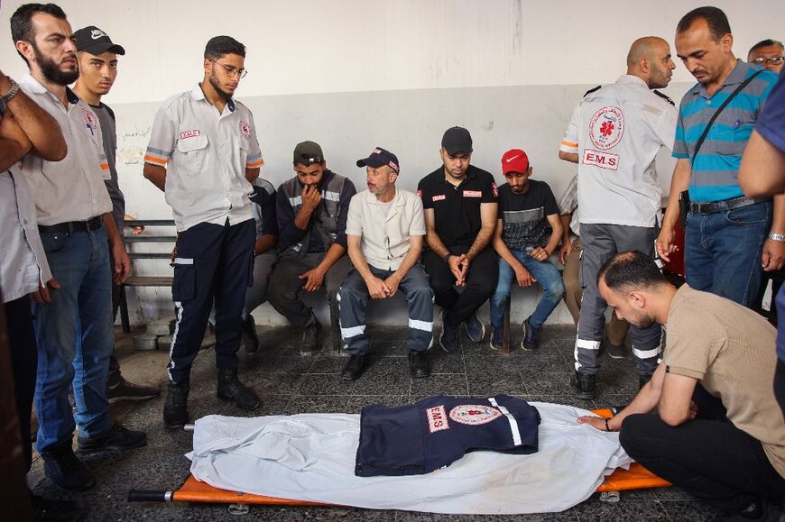 Relatives and medics mourn Palestinian doctor Hani al-Jaafarawi, during his funeral at Al-Ahli Arab hospital, Gaza City 
