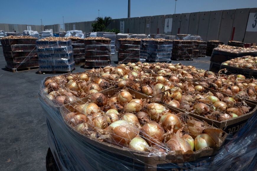 Humanitarian aid for Gazans loaded into trucks at Israel's Kerem Shalom border crossing