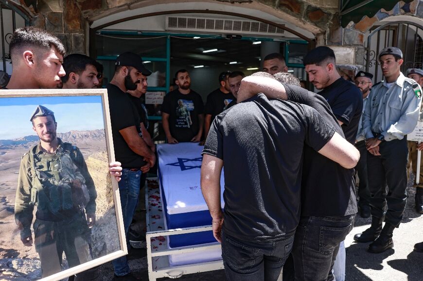 The funeral in Beit Jann, northern Israel, for Wasim Mahmud, a member of Israel's Druze community who was one of eight soldiers killed during a blast in Gaza