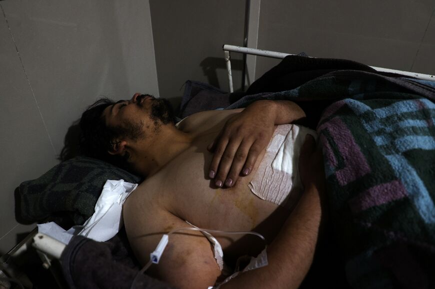 An injured man receives treatment at a hospital in Darat Izza in Syria's Aleppo province