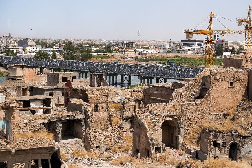 Large parts of the old city of Mosul that were destroyed during the battle to retake the city remain in ruins