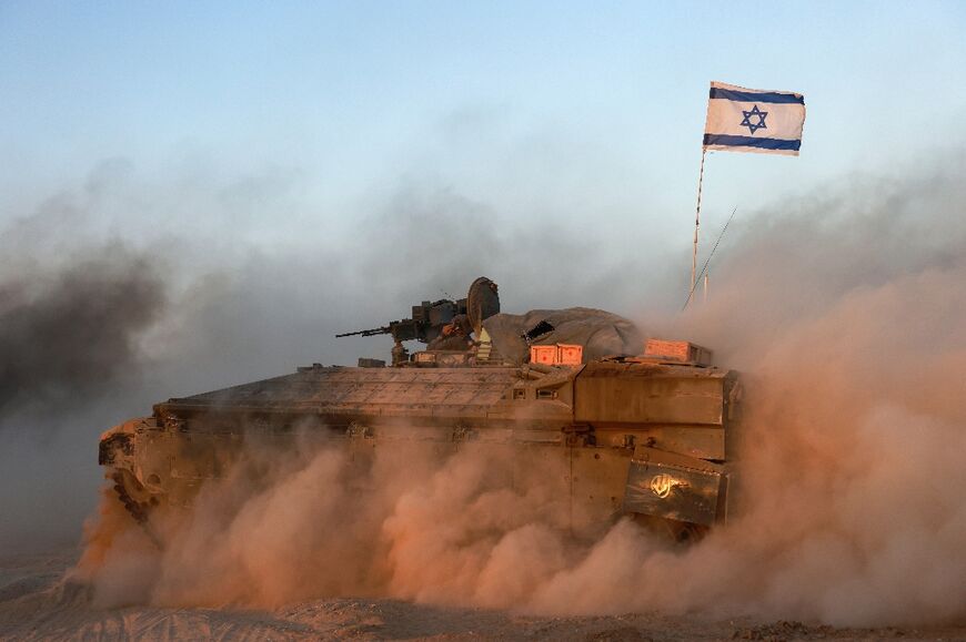 An Israeli military armoured vehicle in an area bordering the Gaza Strip 