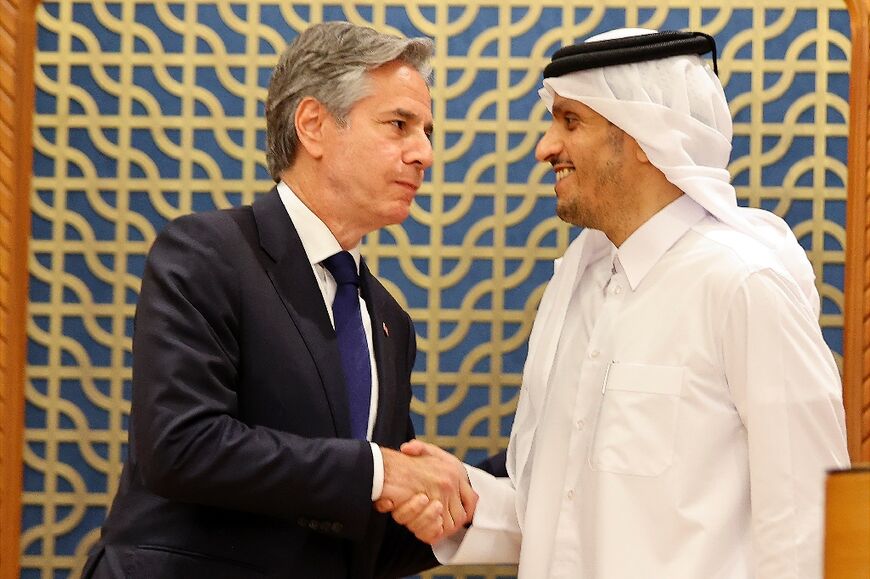 Qatar's Foreign Minister Sheikh Mohammed bin Abdulrahman bin Jassim al-Thani shakes hands with US Secretary of State Antony Blinken during a joint press conference