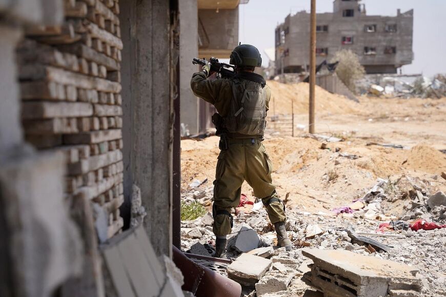An Israeli soldier takes aim during operations in the Gaza Strip