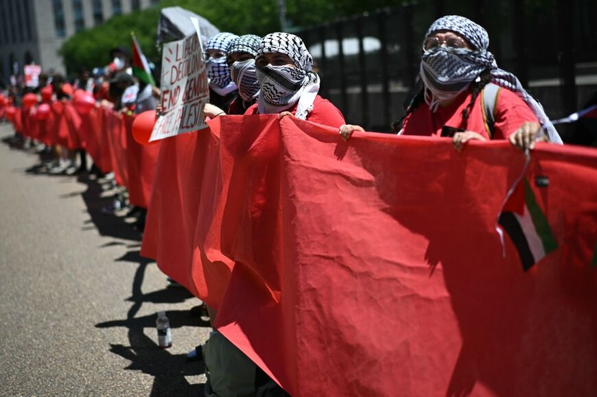 Pro-Palestinian demonstrators holding a 'red line' at a rally near the White House on June 8, 2024