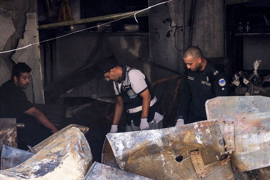 Kuwaiti security forces at the site of the deadly fire