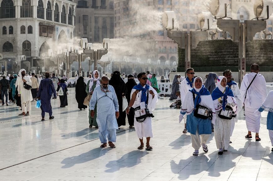 Fans blow air mixed with water vapour to cool off pilgrims at the Grand Mosque in Mecca. Temperatures are expected to average 44 degrees Celsius (111 degrees Fahrenheit) during the hajj.