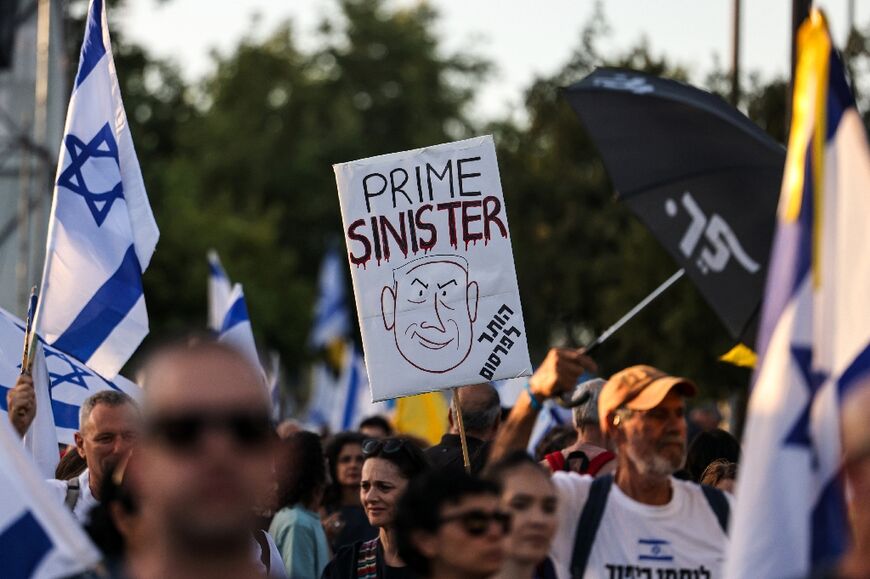Israelis demonstrate in Jerusalem during an anti-government rally calling for early elections