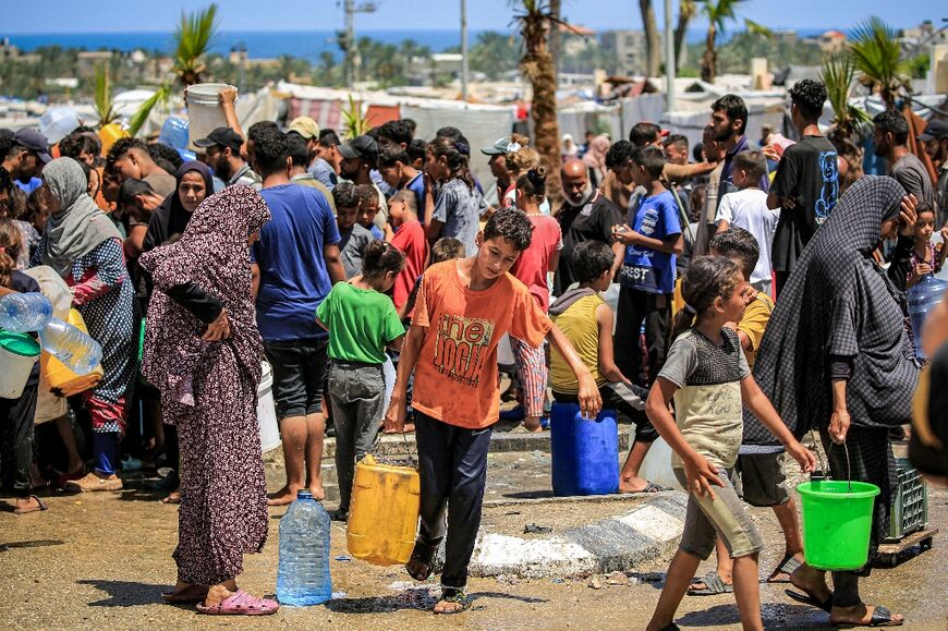 Gazans filling up water in Rafah, the southern city Israel described as Hamas's last stronghold