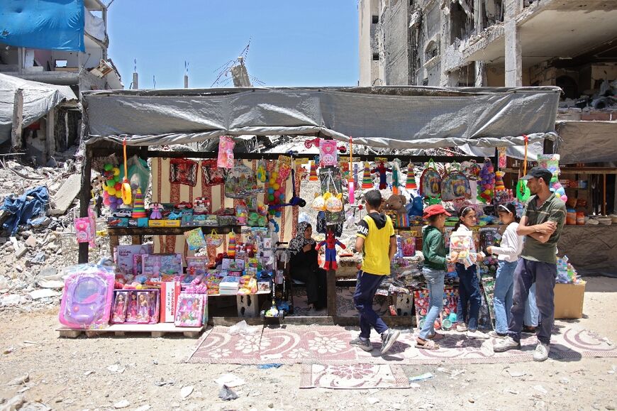 A street vendor sells toys in the Jabalia camp for Palestinian refugees, northern Gaza