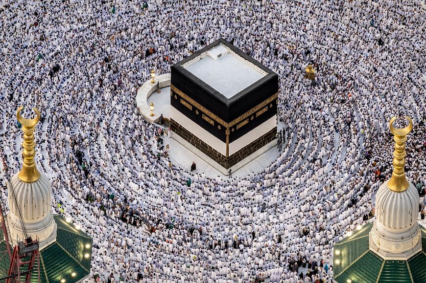 Muslim worshippers pray around the Kaaba, Islam's holiest shrine, at the Grand Mosque in Saudi Arabia's holy city of Mecca 