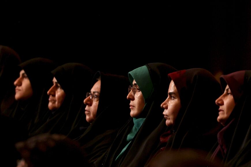 Women attend a campaign rally in Tehran for presidential candidate Saeed Jalili, an ultraconservative former nuclear negotiator