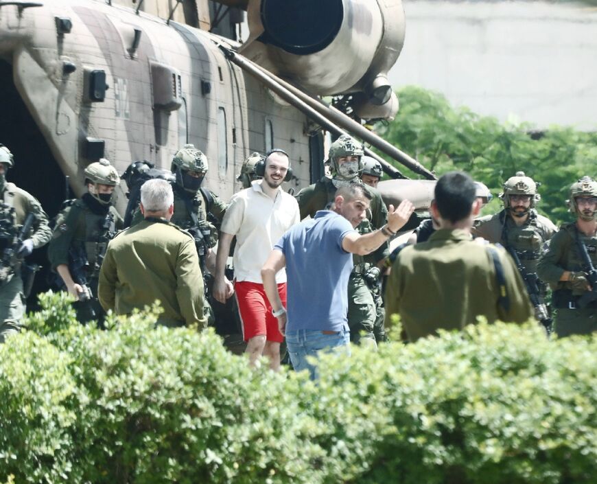 Israeli hostage Andrei Kozlov, 27, exits a helicopter which landed in the grounds of the Sheba Medical Center, after his rescue by the Israeli army from captivity in the Gaza Strip