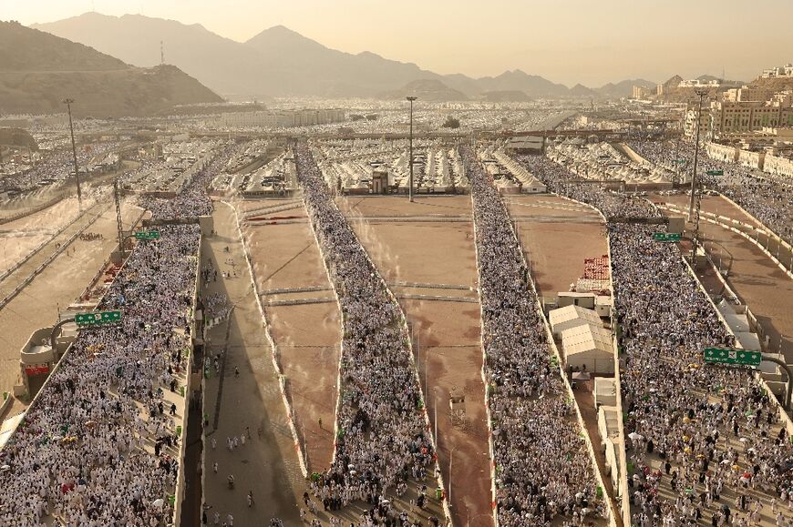 Muslim pilgrims arrive to perform the symbolic 'stoning of the devil' ritual as part of the hajj pilgrimage in Mina, near Saudi Arabia's holy city of Mecca