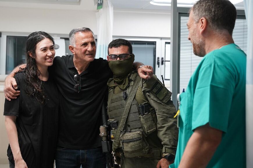 Rescued Israeli hostage Noa Argamani with her father and a military officer at a hospital near Tel Aviv on June 8, 2024