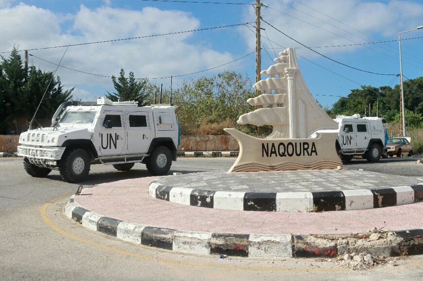UNIFIL armoured vehicles patrol on the entrance of the southern Lebanese town of Naqura