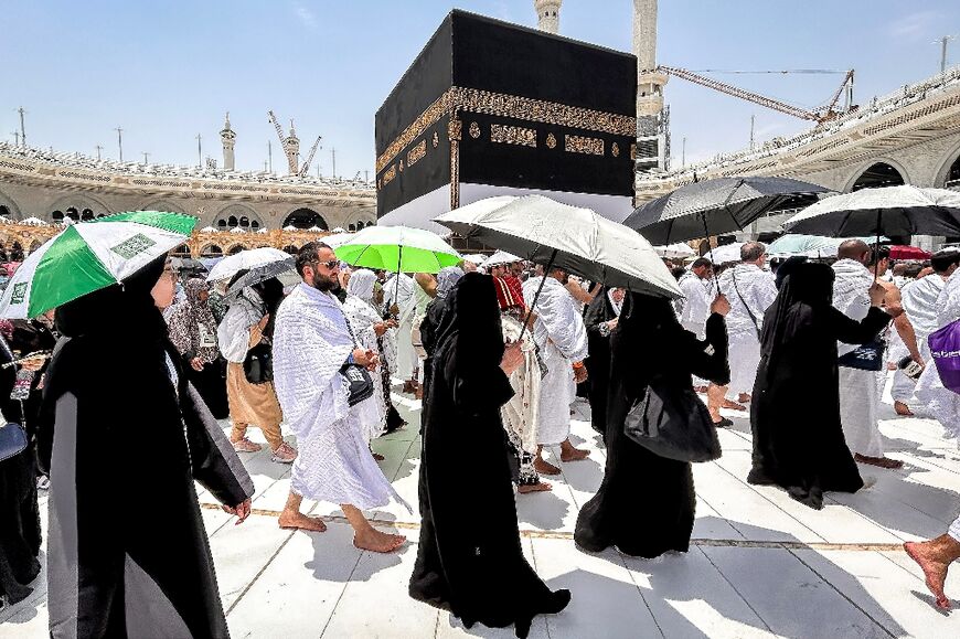 Muslim worshippers walk around the Kaaba as part of the hajj pilgrimage