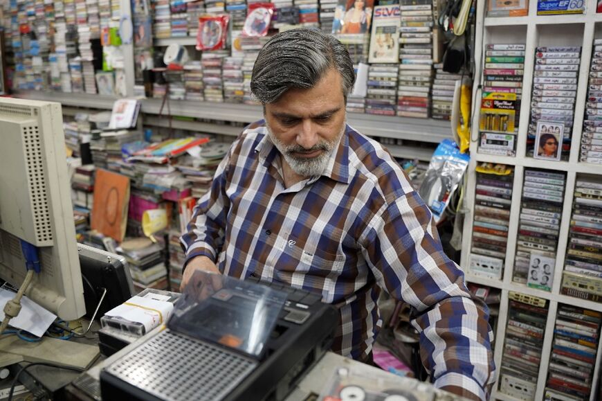 Music shop owner Amar Kheder smuggled out his decades-old collection when IS militants took over the city