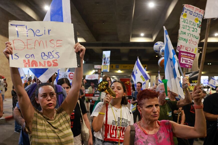 Families and supporters of Israeli hostages held by Hamas in the Gaza Strip protest at Ben Gurion International Airport to demand a hostage-release deal