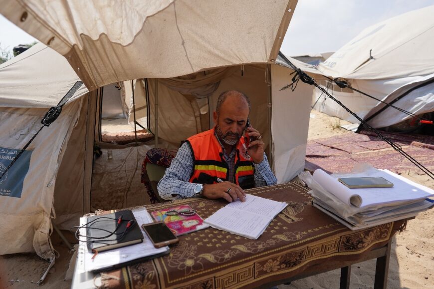 A Civil Defence member in Hamas-ruled gaza sits at their operations center, in Khan Yunis, southern Gaza