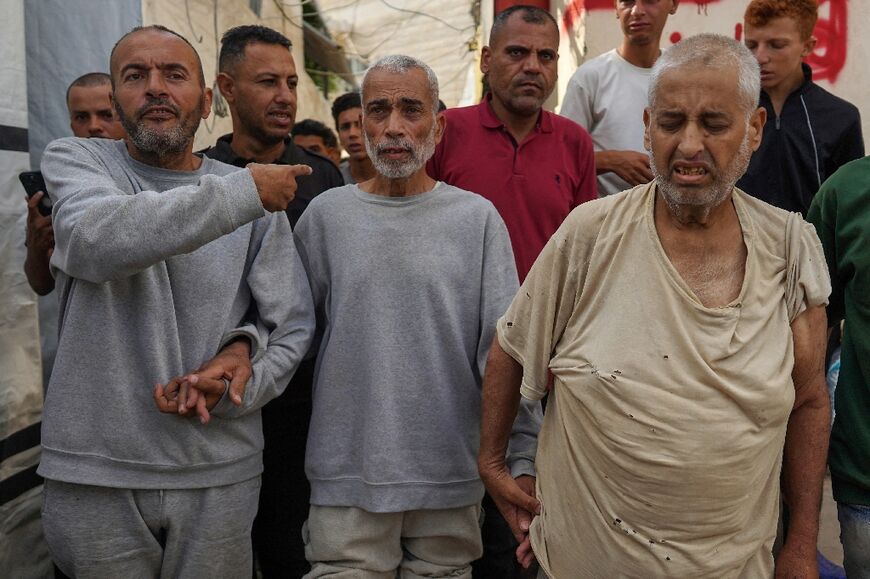 Three of the freed Palestinian prisoners arrive for a check-up at the Al-Aqsa hospital