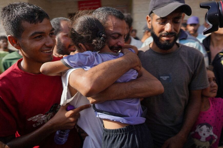 A released Palestinian is welcomed by family and well-wishers at the Al-Aqsa hospital