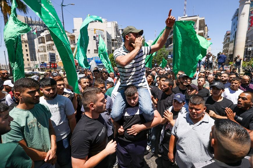 Palestinians hold a protest in the Israeli-occupied West Bank city of Ramallah following the news of Haniyeh's killing