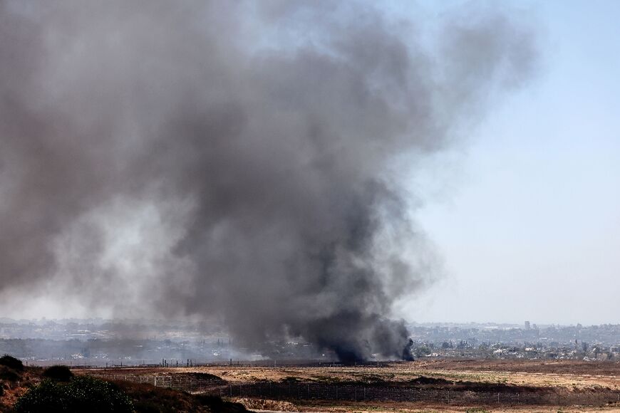 A picture taken from Israel's southern border with the Gaza Strip shows smoke rising from inside the territory on July 2, 2024, amid the ongoing conflict 