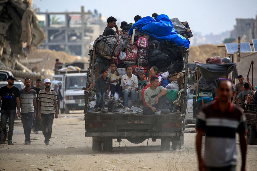 Palestinians arrive in the Gaza city of Khan Yunis from areas to the east following a new evacuation order issued by the Israeli army