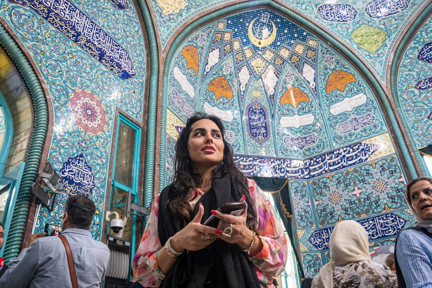 An Iranian woman without hijab who just cast her vote at a polling station in Tehran on July 5, 2024. Polls opened at 8 a.m. local time on July 5 for Iran's runoff presidential election, the interior ministry said, pitting reformist candidate Masoud Pezeshkian against ultraconservative Saeed Jalili in the race to succeed Ebrahim Raisi, who died in a May helicopter crash. (Photo by Khoshiran / Middle East Images / Middle East Images via AFP) (Photo by KHOSHIRAN/Middle East Images/AFP via Getty Images)