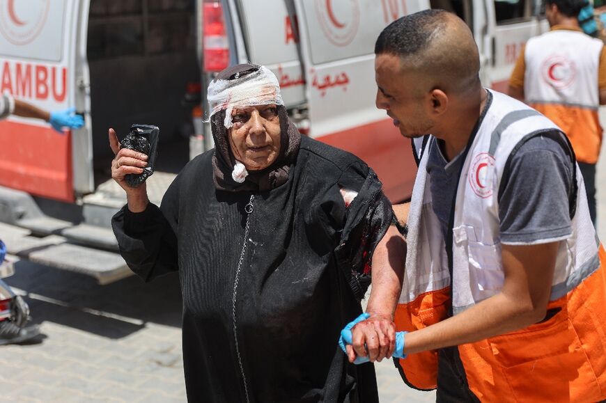 A wounded Palestinian woman is brought to the Indonesian Hospital in Beit Lahia in northern Gaza